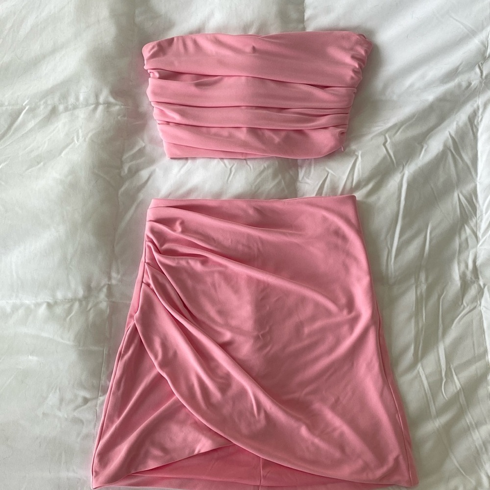 Pink two piece mini skirt and corset crop top set. New without tags never worn.